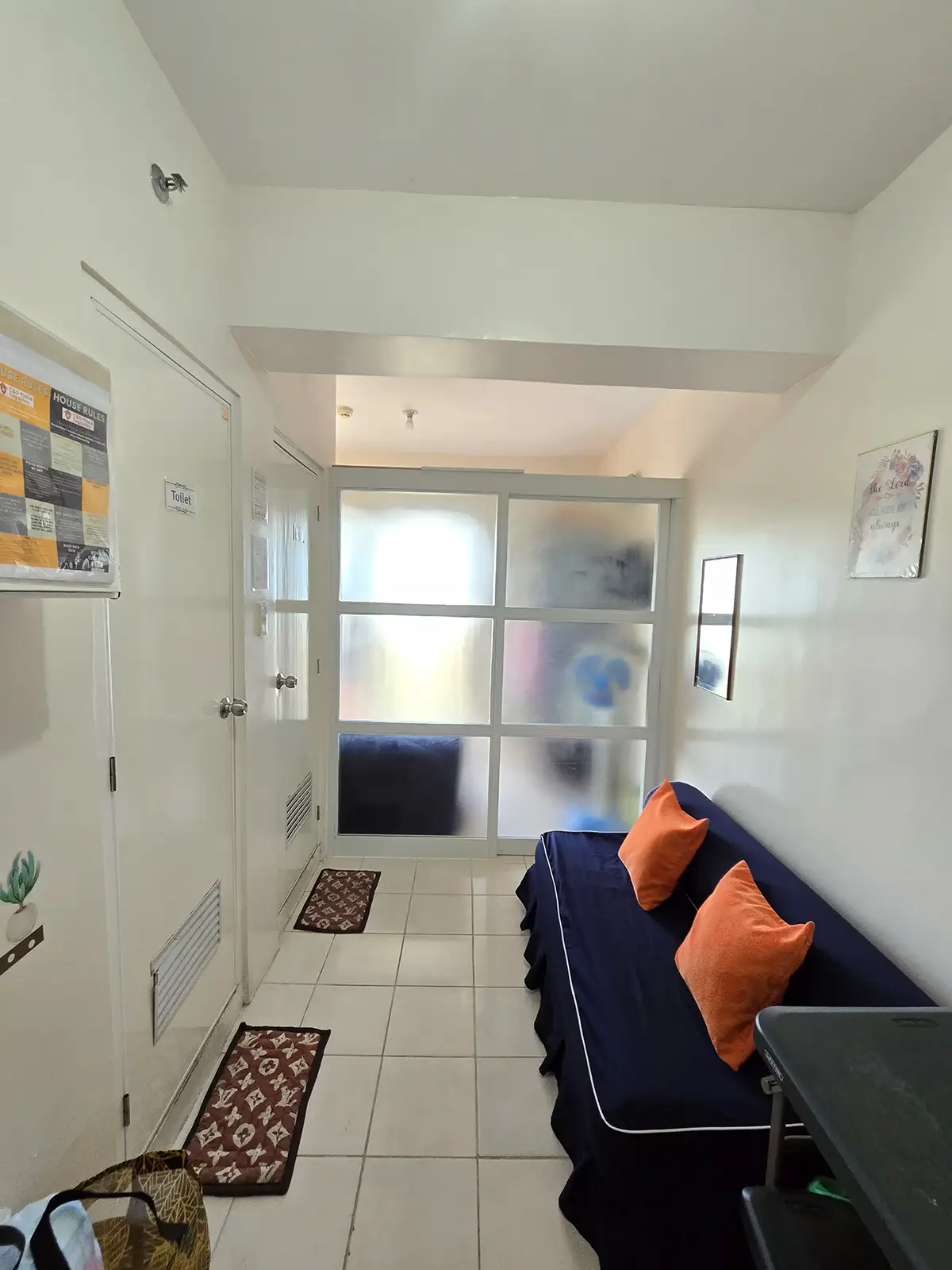 Navy sofa and dining table in the living area